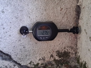 Digital crackmeter mounted at an angle for manual crack monitoring